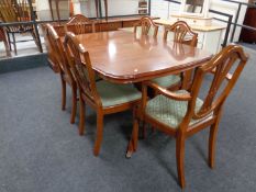 A Strong Bow Furniture inlaid yew wood twin pedestal extending dining table and six chairs,