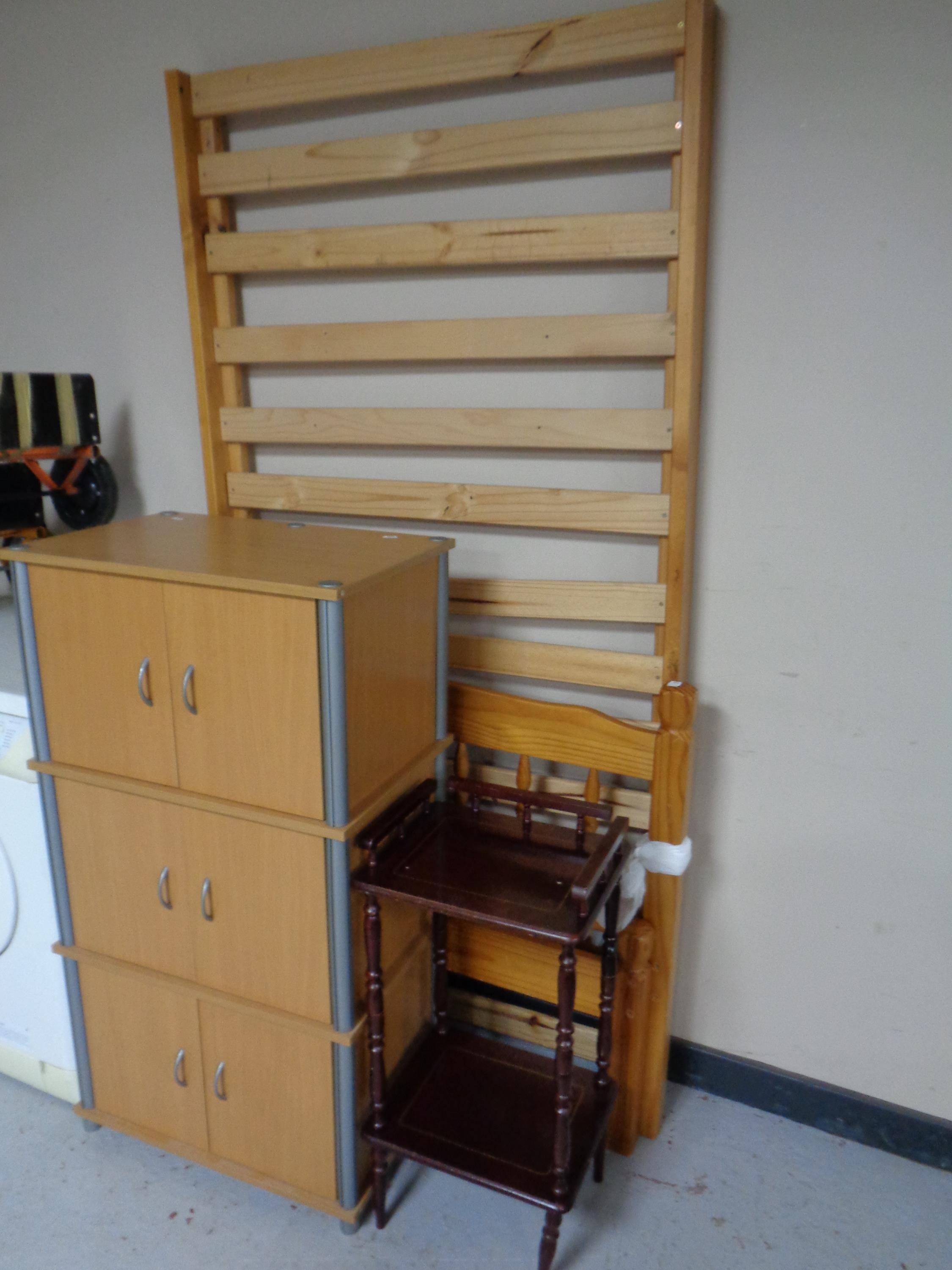 A pine effect cabinet together with a 3ft pine bed frame and a two tier telephone table