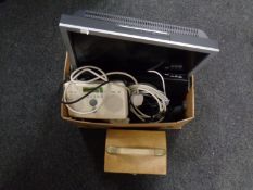 A box containing Sony Bravia TV with remote, Roberts digital radio,