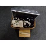 A box containing Sony Bravia TV with remote, Roberts digital radio,