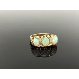An gold opal and diamond ring, size P CONDITION REPORT: Apparently unmarked. 4.8g.