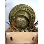 A box of a quantity of antique and later brass companion pieces, pair of brass fire dogs,