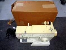 A Singer Melodie 40 electric sewing machine in original box