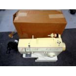 A Singer Melodie 40 electric sewing machine in original box