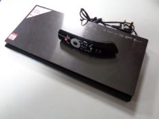 An LG 3D Blu Ray player with instructions and remote