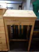A pine clerk's desk fitted a drawer on raised legs