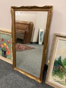 A bevelled gilt framed mirror,