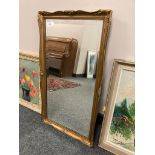 A bevelled gilt framed mirror,
