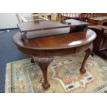 A Victorian mahogany oval-shaped wind-out dining table, with rope-effect edge,