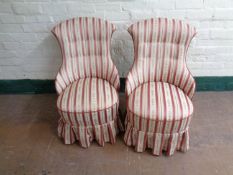A pair of antique bedroom chairs upholstered in a regency striped fabric