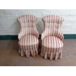 A pair of antique bedroom chairs upholstered in a regency striped fabric