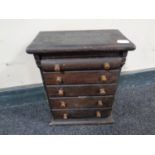 A 19th century miniature five drawer chest