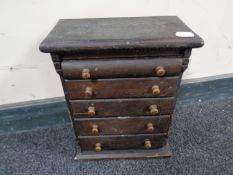 A 19th century miniature five drawer chest