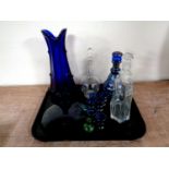 A tray of antique and later glass ware to include liqueur decanters with glasses, blue glass vase,