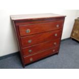 An antique pine stained four drawer chest