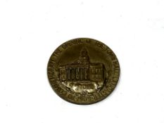 A commemorative medallion,