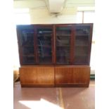 A pair of Danish mid 20th century double door glazed bookcases,