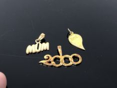 Three gold plated on silver charms