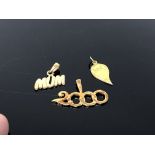 Three gold plated on silver charms