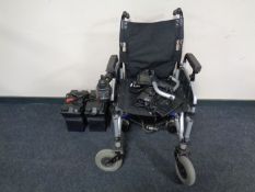 An electric wheelchair with batteries and charger