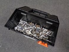 A plastic toolbox containing socket sets