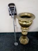 An ornate brass planter together with a shooting stick