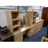 A contemporary double door sideboard fitted five central drawers in a pine finish together with