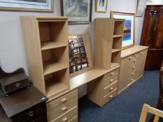 A contemporary double door sideboard fitted five central drawers in a pine finish together with