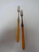 Two Birmingham silver pickle forks with resin handles