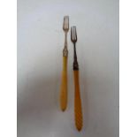 Two Birmingham silver pickle forks with resin handles