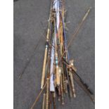 A large bundle of assorted fishing rods