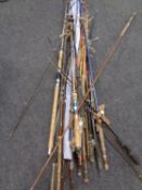 A large bundle of assorted fishing rods