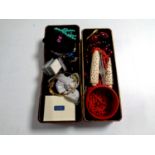 An oriental style lacquered trinket box containing assorted costume jewellery to include Bakelite