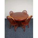 A circular pedestal extending kitchen table together with four chairs and two further boxed flat