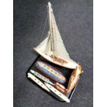 A tray containing two wooden models, yachts, together with five further models,
