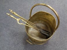 A 19th century brass coal bucket together with three brass companion pieces