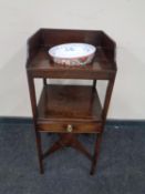 A George III mahogany wash stand with a contemporary Chinese bowl