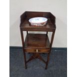 A George III mahogany wash stand with a contemporary Chinese bowl