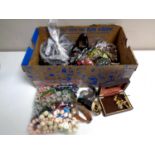 A box containing a large quantity of costume jewellery, lady's and gent's wristwatches,