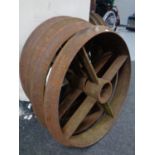 A set of four cast iron cart wheels