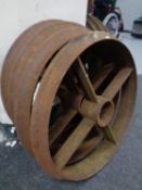 A set of four cast iron cart wheels