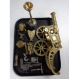 A tray containing assorted brass ornaments, brass cannon, pocket calendar, miniature miner's lamp,