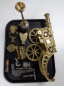 A tray containing assorted brass ornaments, brass cannon, pocket calendar, miniature miner's lamp,