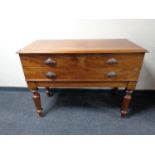 A Victorian three drawer serving table on raised legs