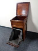 An Edwardian coal receiver cabinet with liner