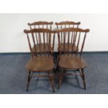 A set of four spindle back kitchen chairs
