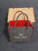 A wicker hamper together with a DeVere and Brooks cloth bag