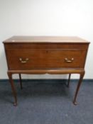 A Victorian mahogany secretaire on raised legs