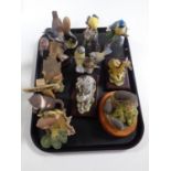 A tray containing assorted animal ornaments to include Heredities hedgehog family,