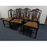 A set of six 19th century shield back dining chairs comprising of two carvers and four singles.